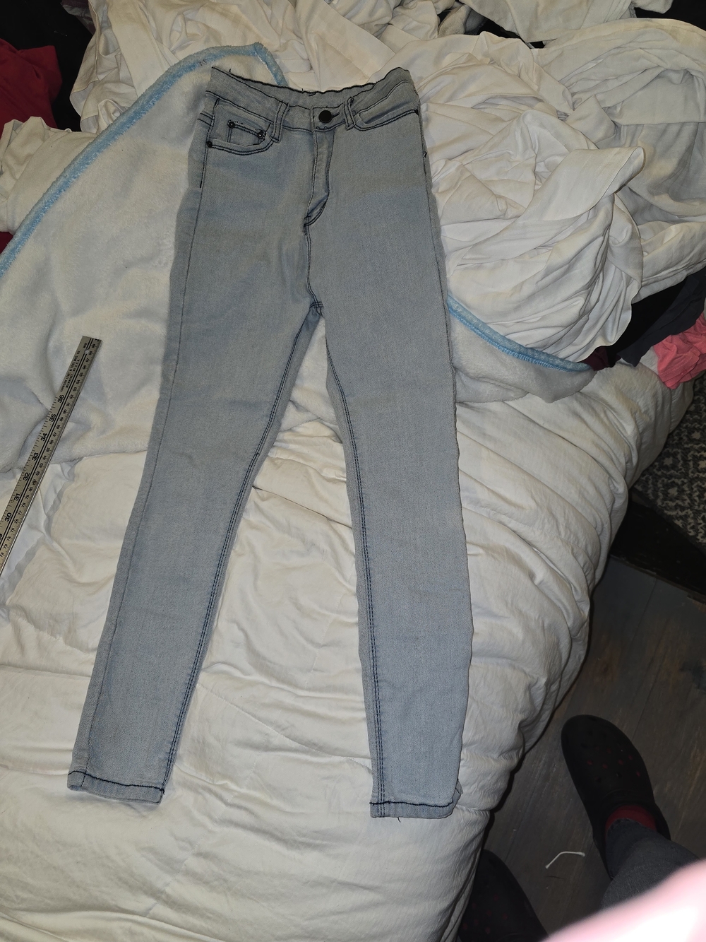 Light Wash Blue Women’s Skinny Jeans With Black Stitching.